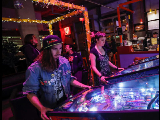 Playing Stern Pinball games.